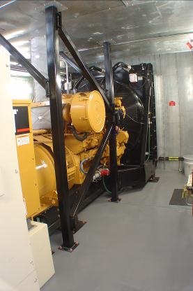 750 kW Caterpillar sound attenuated emergency standby diesel generator module showing right hand skid view.