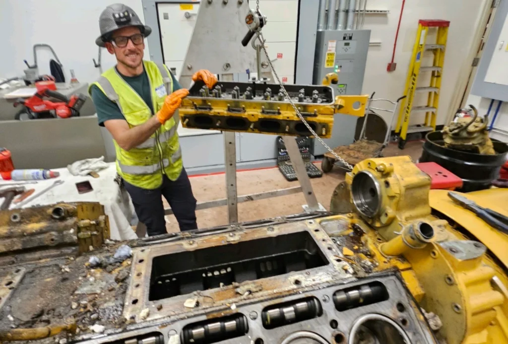 NAPC team member moving heavy duty equipment